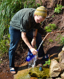 spring-water-collecting-with-blue-bottle-love